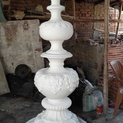 A turned pillar section, primed white